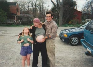 Tyler with her mom & stepfather (and baby sister on the way) when she was a kid