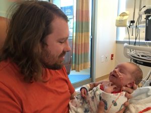 Jared with newborn JJ in the NICU